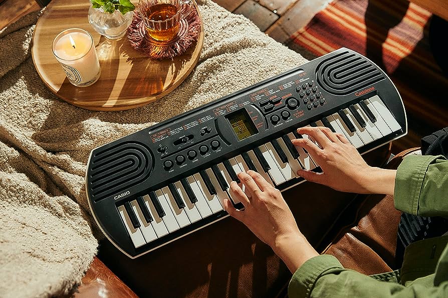 Casio SA-81 mini tastiera + Alimentatore e Cuffie