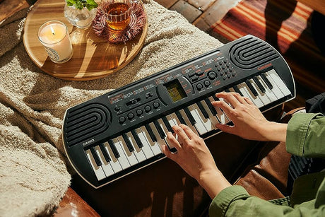 Casio SA-81 mini tastiera + Alimentatore e Cuffie